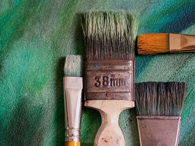 used paintbrushes - top tips for organising your garden shed - shed - goodhomesmagazine.com