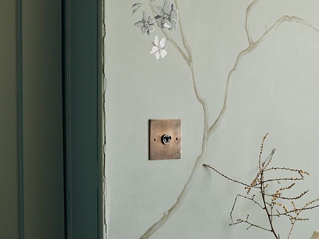 oxidised brass light switch on floral print wallpaper - shopping - goodhomesmagazine.com