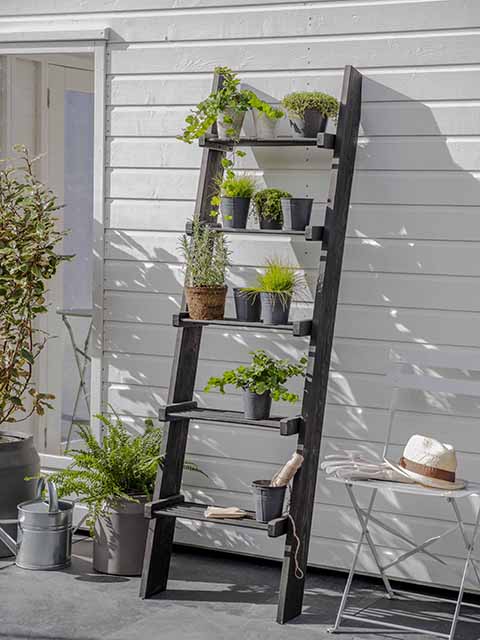 Outdoor plant ladder with garden accessories, goodhomesmagazine.com
