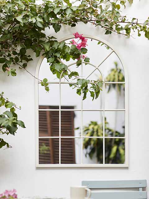 Outdoor mirror with garden accessories, goodhomesmagazine.com