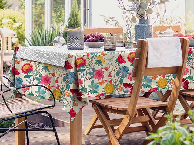 Outdoor dining area styled with garden accessories, goodhomesmagazine.com