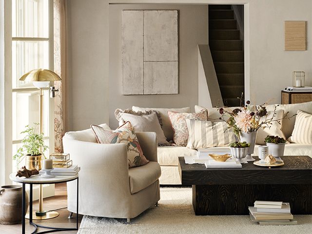 beige sofa and brass accents - sneak preview of H&M Home's upcoming collection - shopping - goodhomesmagazine.com