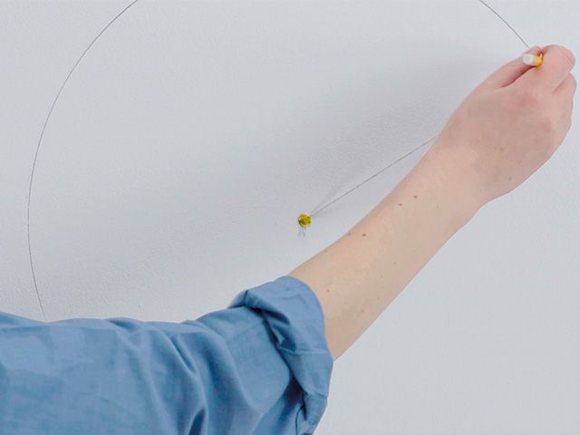 drawing a circle on wall - how to paint a perfect circle wall design - inspiration - goodhomesmagazine.com