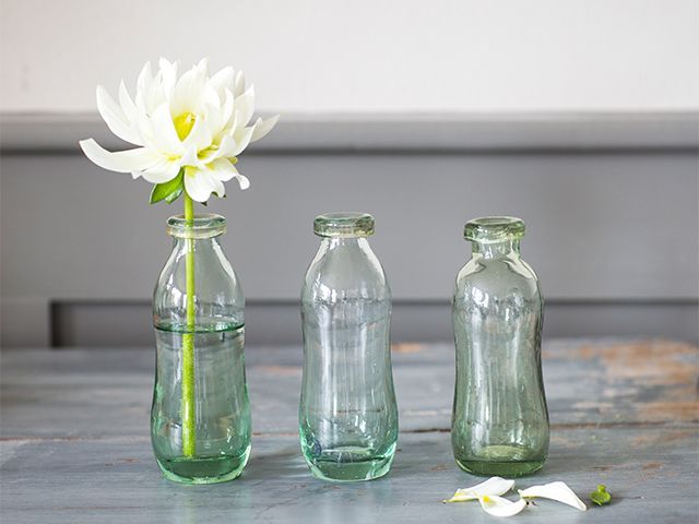 glass bottles vase - 5 creative ways to decorate your kitchen for free - kitchen - goodhomesmagazine.com