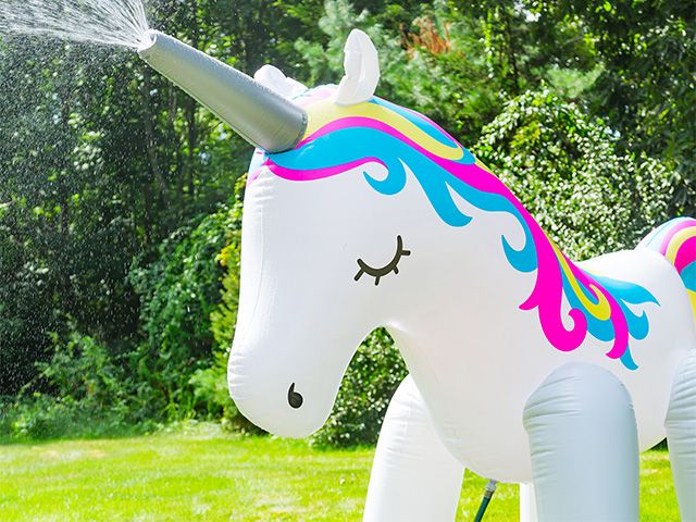 unicorn sprinkler - add magic to your garden with this giant unicorn sprinkler - news - goodhomesmagazine.com
