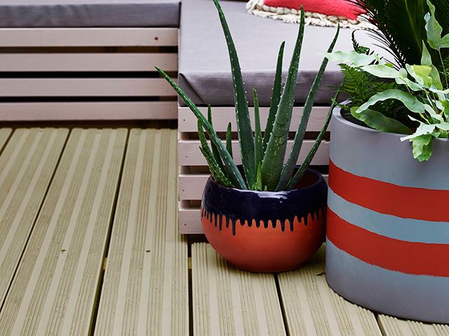 decking in a modern colourful garden - goodhomesmagazine.com