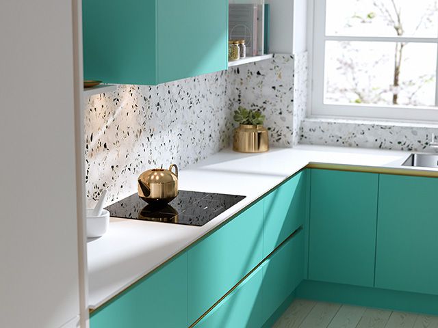 Sleek modern kitchen in spearmint green - goodhomesmagazine.com