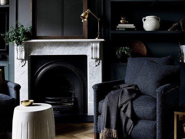 black living room with fireplace - 5 dark interior myths debunked - inspiration - goodhomesmagazine.com