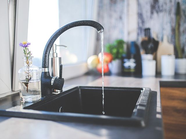 black sink in modern kitchen - how to make your kitchen more eco-friendly - kitchen - goodhomesmagazine.com