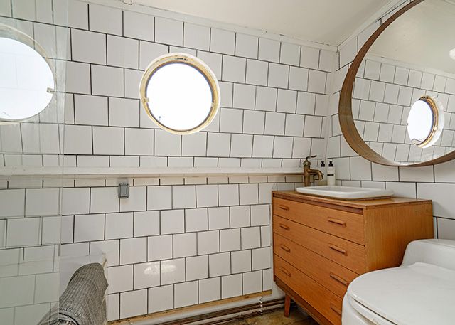 Tile bathroom with basin on a house boat - house tour - goodhomesmagazine.com