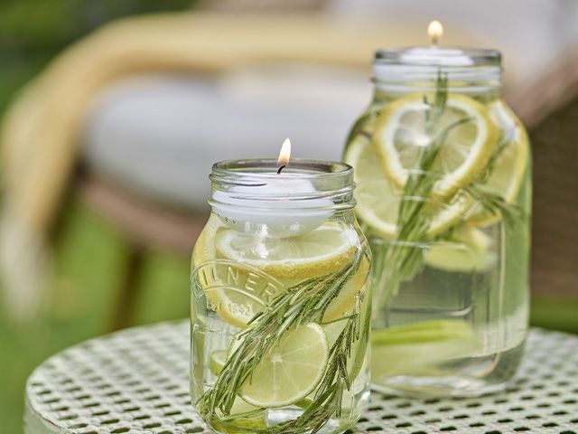 bug candles - how to make a natural bug repellent for your garden - garden - goodhomesmagazine.com