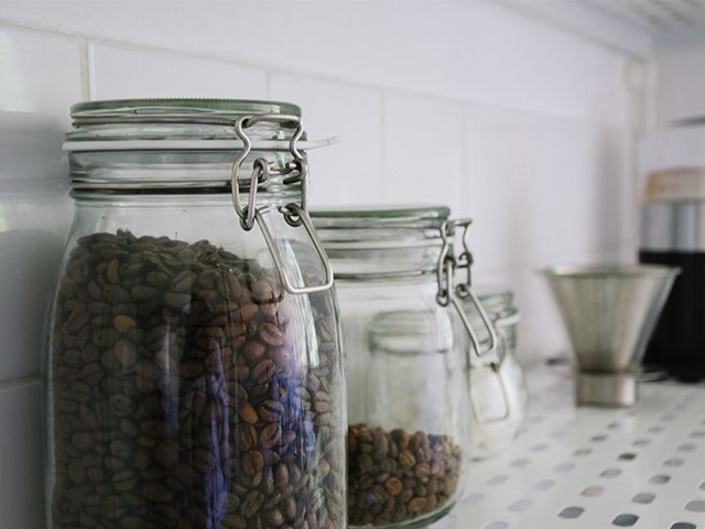 coffee in glass jars - how to make your kitchen more eco-friendly - kitchen - goodhomesmagazine.com