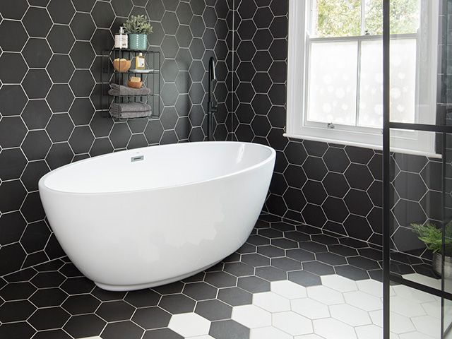monochrome bathroom with split colour floor tiles - inspiration - goodhomesmagazine.com