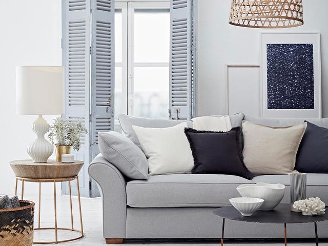 grey fabric sofa - 6 ways to reinvigorate a tired sofa - living room - goodhomemsagazine.com