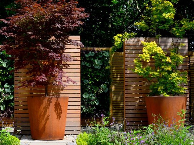 large outdoor pots - top tips for making a small garden look bigger - garden - goodhomesmagazine.com