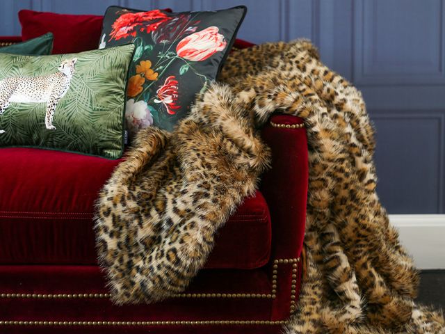 leopard throw on sofa - 6 ways to reinvigorate a tired sofa - living room - goodhomesmagazine.com