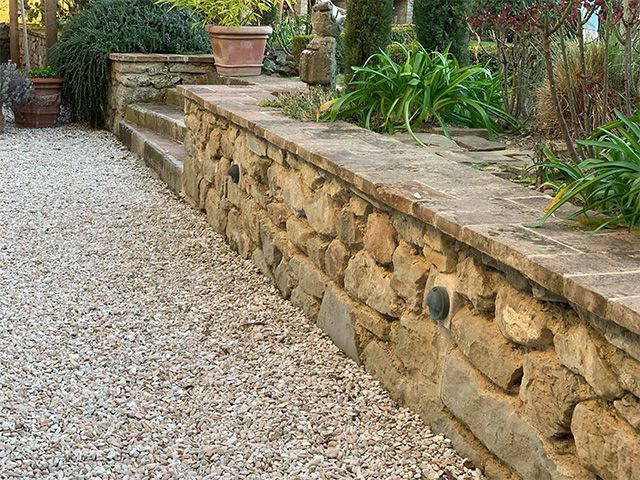 stone wall - how to incorporate reclaimed materials in your home - inspiration - goodhomesmagazine.com