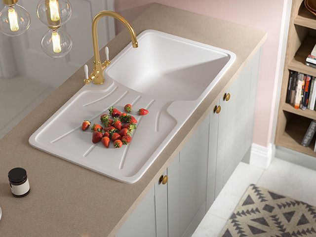 an inset sink with draining board