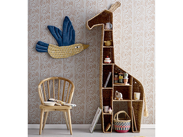 Wicker and rattan giraffe storage in gender neutral nursery