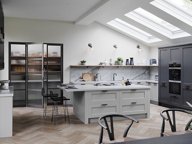grey kitchen with modern island and pantry - goodhomesmagazine.com