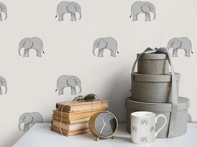 Elephant print wallpaper with grey accessories
