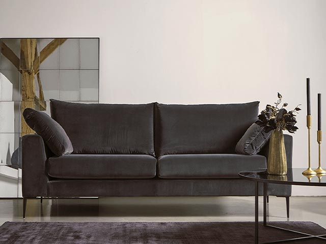 black sofa - a guide to choosing the perfect velvet sofa - living room - goodhomesmagazine.com