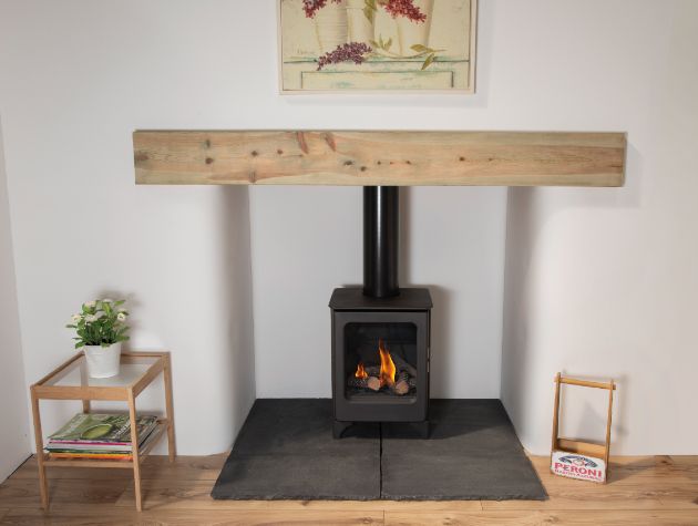 black stove in lounge with flames hearth and mantel