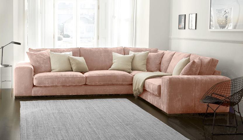 corner pink sofa - a guide to choosing the perfect velvet sofa - living room - goodhomesmagazine.com