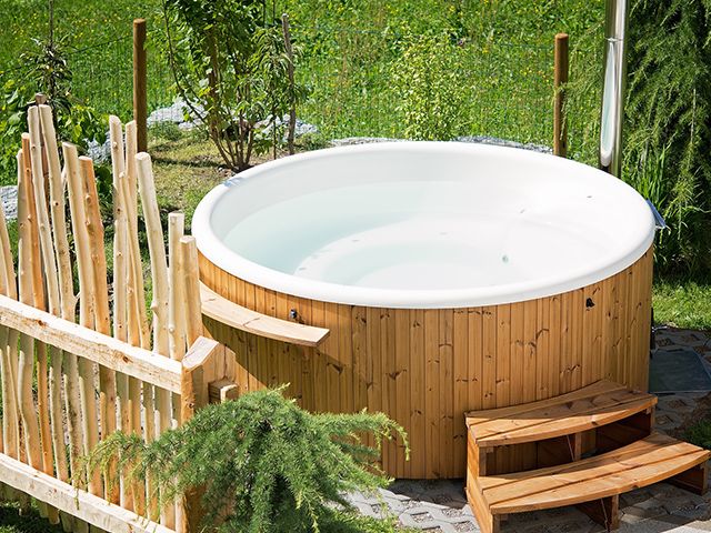 garden hot tub - how to keep your hot tub clean this summer - shopping - goodhomesmagazine.com