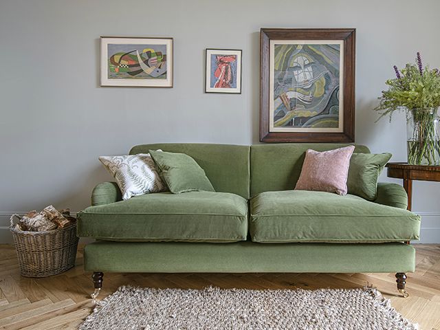 green slumped sofa - a guide to choosing the perfect velvet sofa - living room - goodhomesmagazine.com