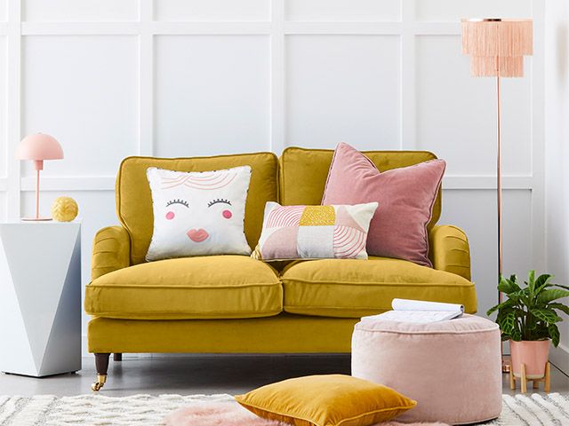 mustard sofaand fringe light - how to incorporate the grandmillennial trend - inspiration - goodhomesmagazine.com