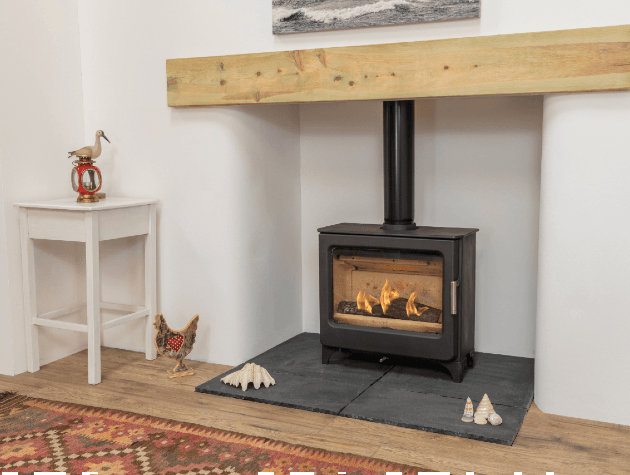 wide stove in lounge with mantel and hearth