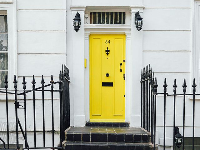 yellow front door townhouse - how to successfully dress your front door - inspiration - goodhomesmagazine.com