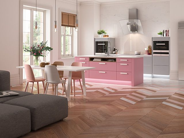 Baby pink modern kitchen with a herringbone floor - goodhomesmagazine.com