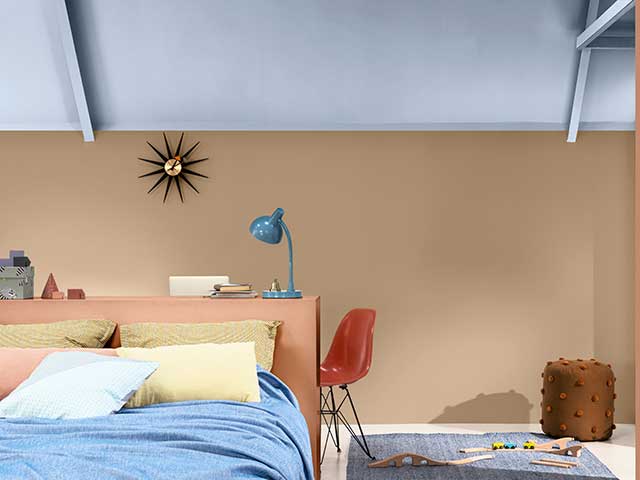 Dulux colour of the year on sloping ceiling with cream walls and bed