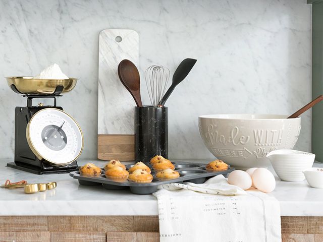 https://www.goodhomesmagazine.com/wp-content/uploads/2020/09/amara-black-brass-kitchen-scales-with-baking-accessories.jpg