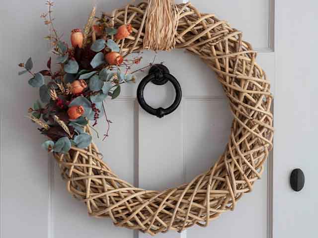 autumn straw rattan wreath - 5 autumn wreaths for a stylish front door - inspiration - goodhomesmagazine.com