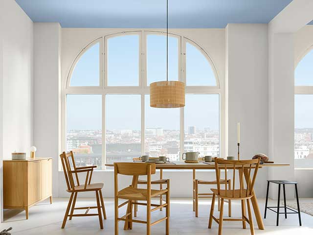 Dulux colour of the year in dining room setting with large window