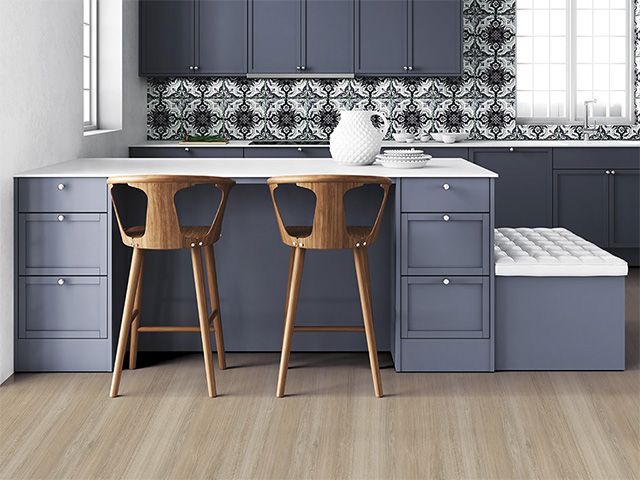 wooden flooring in a blue kitchen - goodhomesmagazine.com