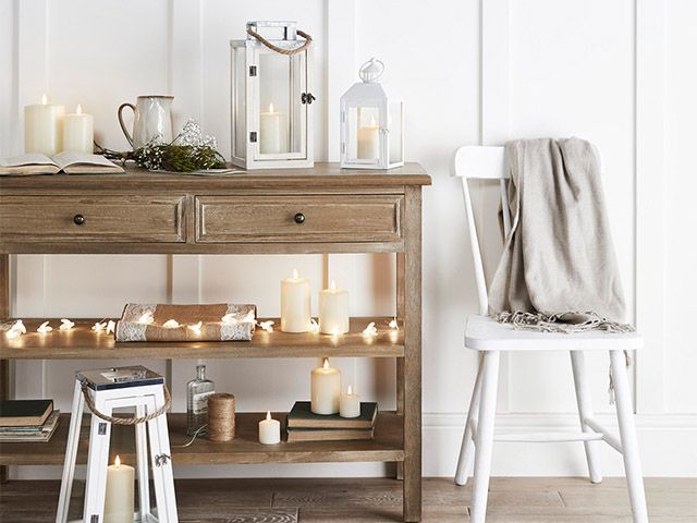 sideboard with fairylights - 5 ways to create a cosy lighting scheme - inspiration - goodhomesmagazine.com