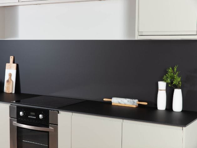 Black kitchen worktop with white doors