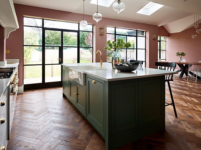 Pink and green open plan kitchen with crittall style doors - goodhomesmagazine.com