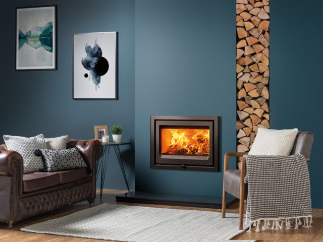 Inset wood burner in a blue living room