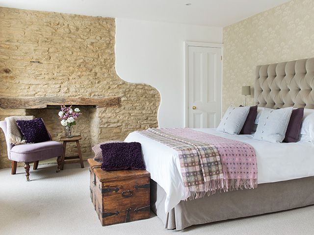 bedroom with exposed stone wall - inspiration - goodhomesmagazine.com