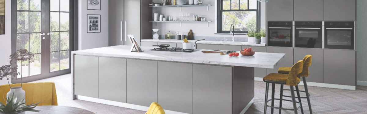 grey kitchen with marble worktop and seating