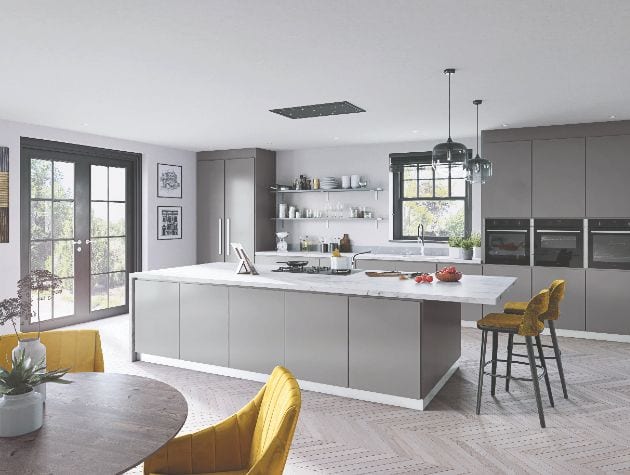 grey kitchen with marble worktop and seating