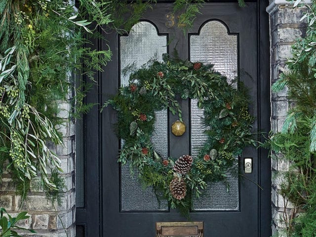 christmas front door with foliage arch - garden - goodhomesmagazine.com