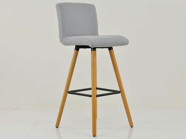 grey fabric bar stool with wooden legs on sale from lakeland furniture