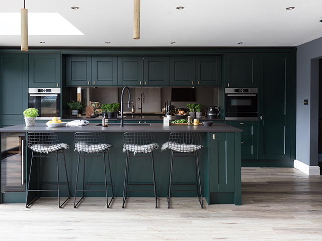 dark green moody kitchen