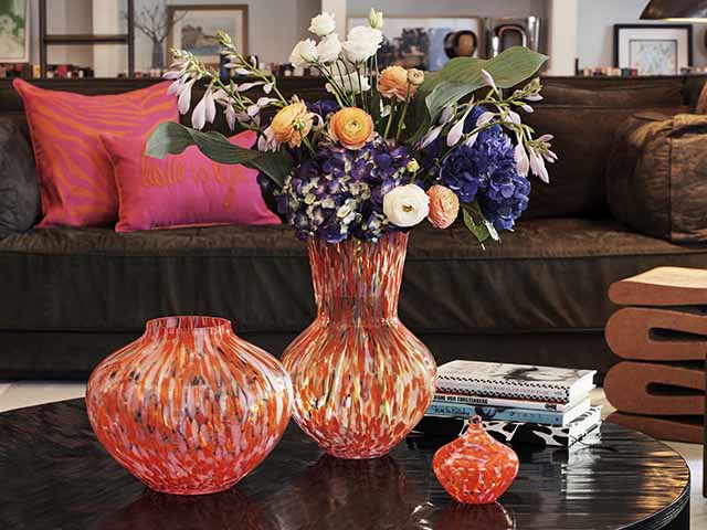 Bright colourful Diane von Furstenburg vase in black living room with bright accessories, goodhomesmagazine.com